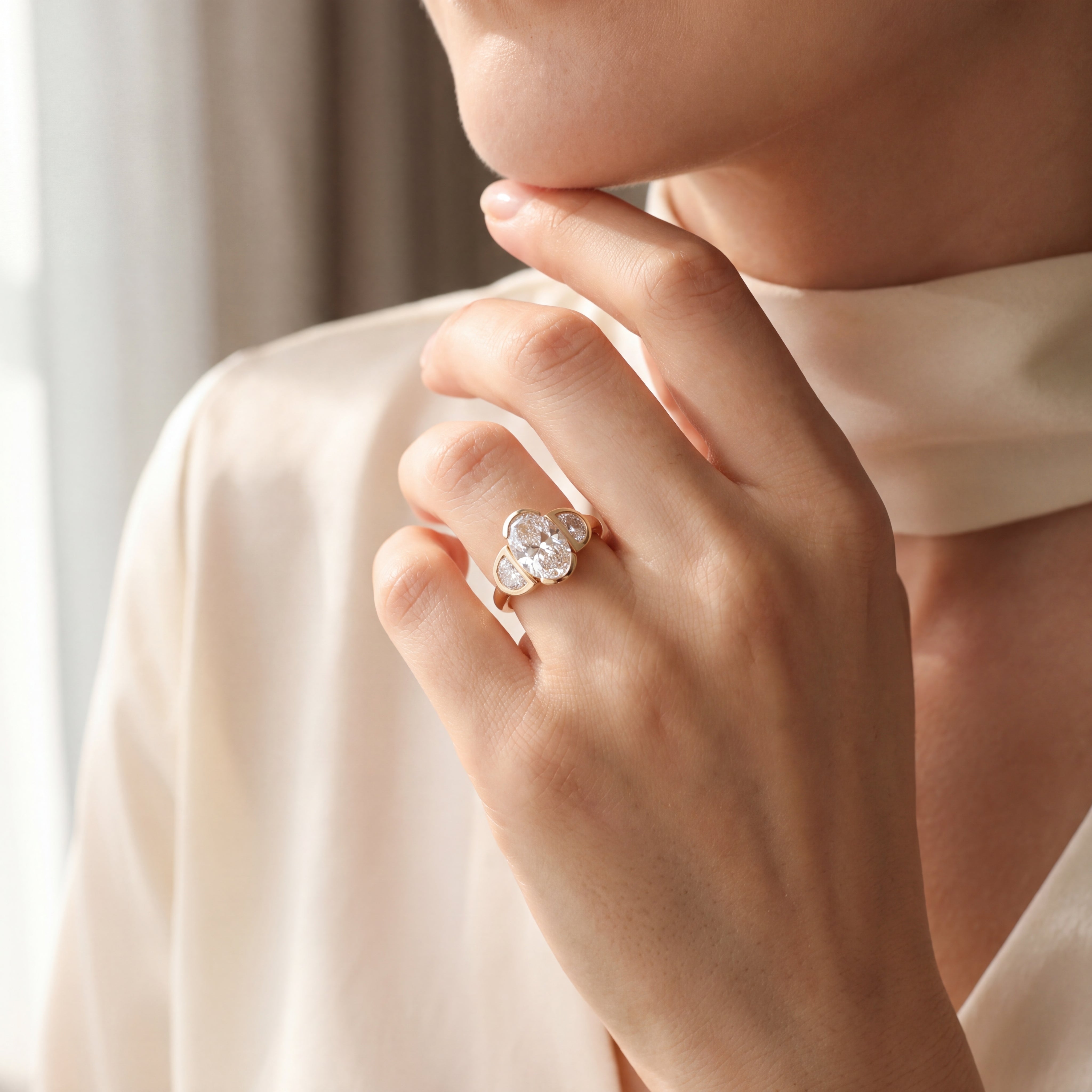 Sevilla - Oval Diamond Three-Stone Bezel Ring