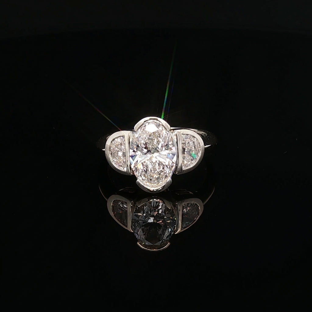 Sevilla - Oval Diamond Three-Stone Bezel Ring