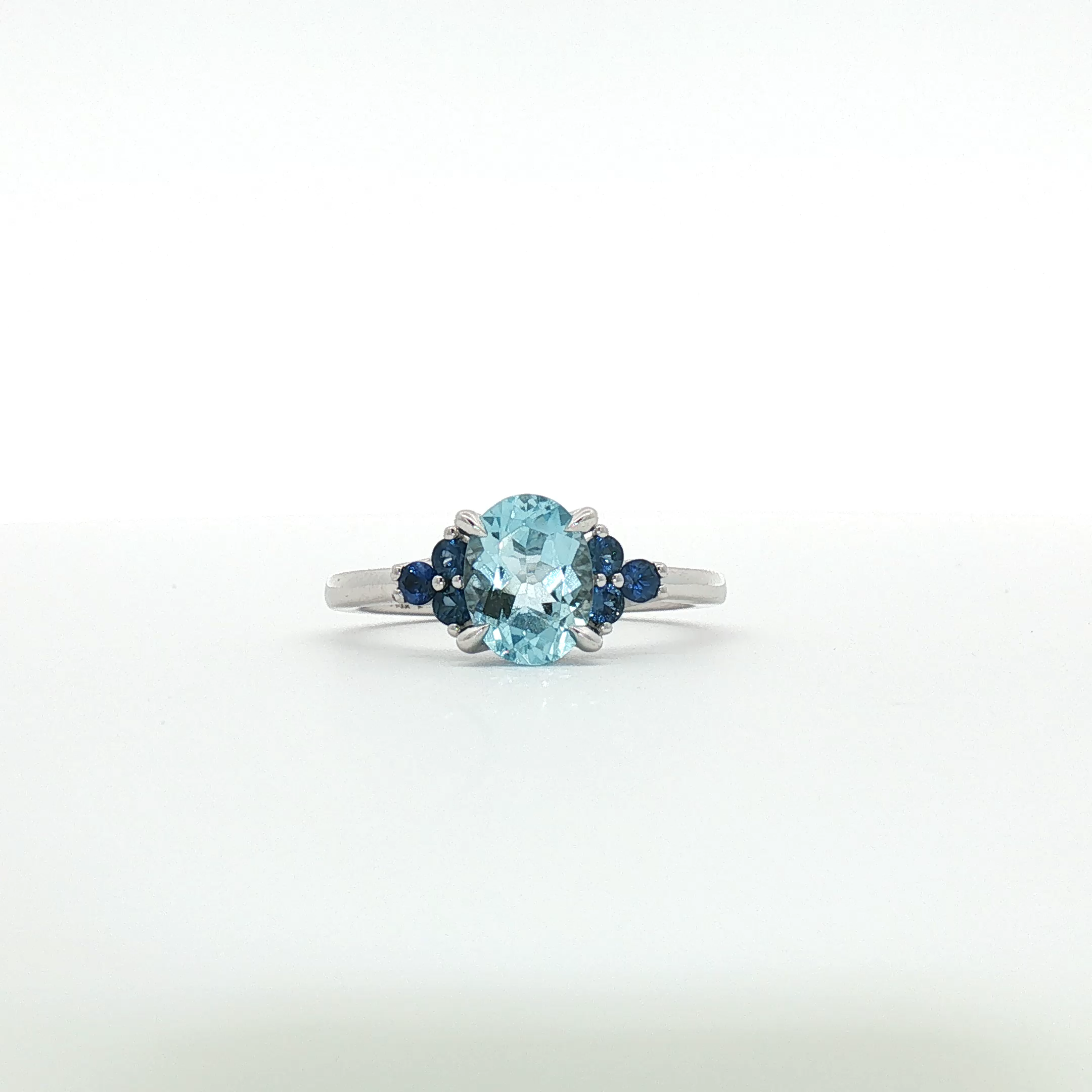 Nerissa - Oval Blue Topaz Three-Stone Ring in White Gold